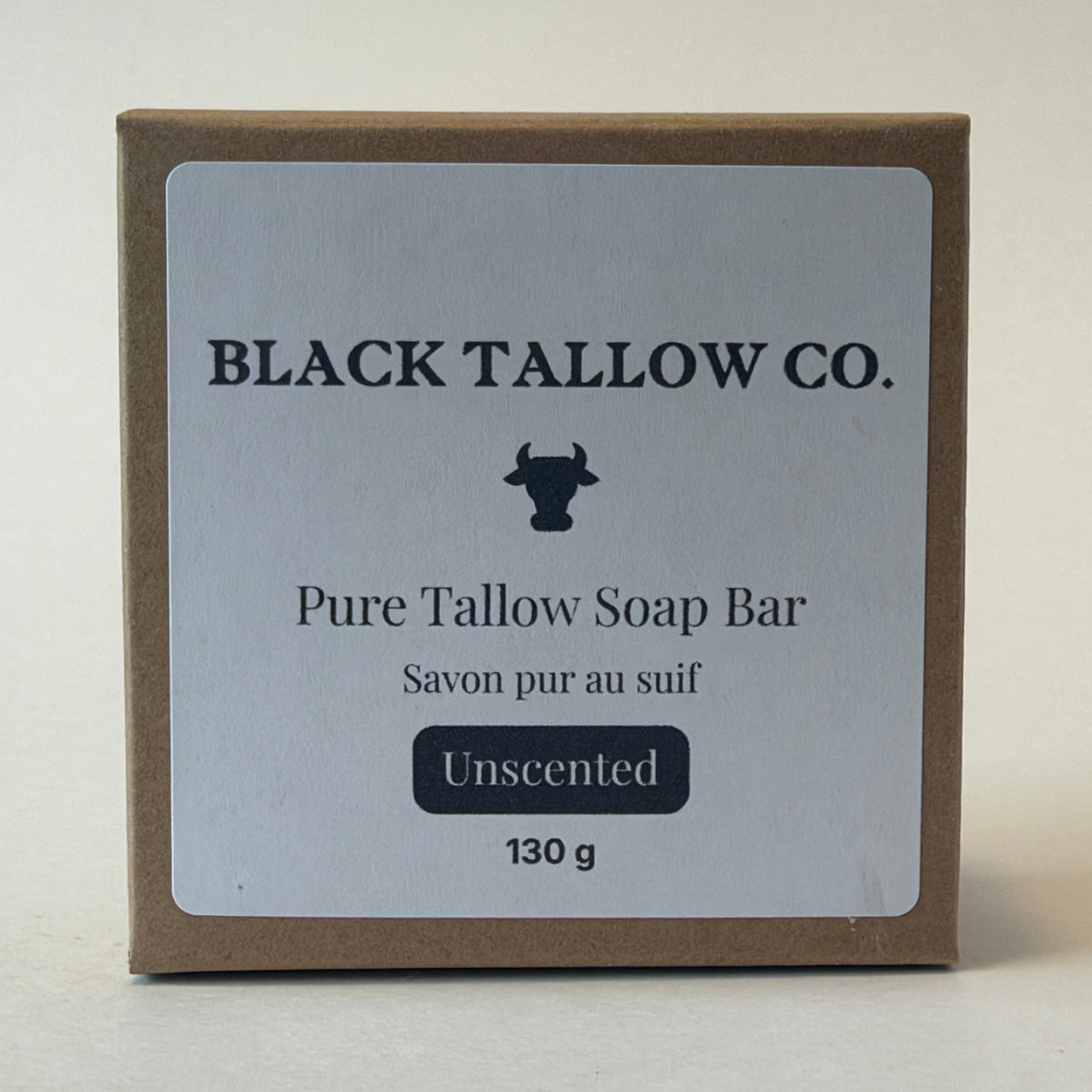 A square brown kraft paper box of Black Tallow Co. Pure Tallow Soap Bar, Unscented, 130g, shown on a neutral light beige background.